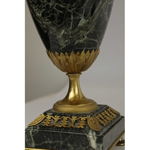 141 - A PAIR OF FRENCH GREEN VARIEGATED MARBLE EMPIRE LAMPS. (3). ormolu mounted with shades. Along with a... 