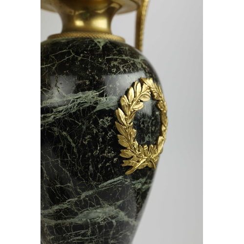 141 - A PAIR OF FRENCH GREEN VARIEGATED MARBLE EMPIRE LAMPS. (3). ormolu mounted with shades. Along with a... 