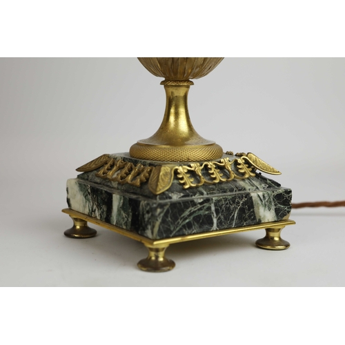 141 - A PAIR OF FRENCH GREEN VARIEGATED MARBLE EMPIRE LAMPS. (3). ormolu mounted with shades. Along with a... 