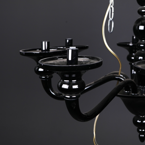 186 - BLACK GLASS CHANDELIER. 8 branch, 65cm drop approx. not including any chain or fittings.