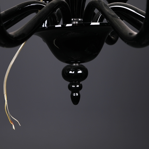 186 - BLACK GLASS CHANDELIER. 8 branch, 65cm drop approx. not including any chain or fittings.
