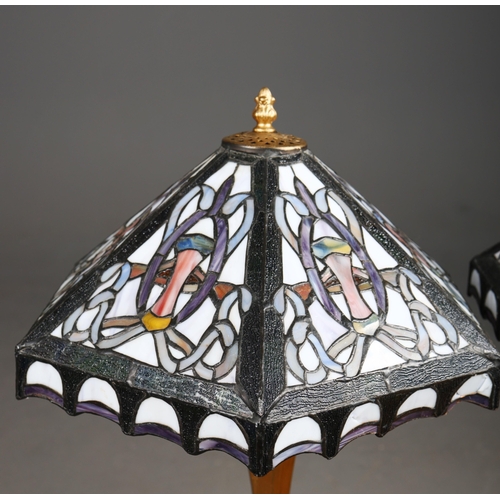 129 - TIFFANY STYLE TABLE LAMPS, A PAIR. each with hexagonal shades with a repeated symmetrical designs, r... 