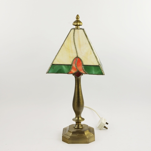 131 - TIFFANY STYLE TABLE LAMP. fitted with a four sided shade in cream and green, raised on a brass lamp ... 