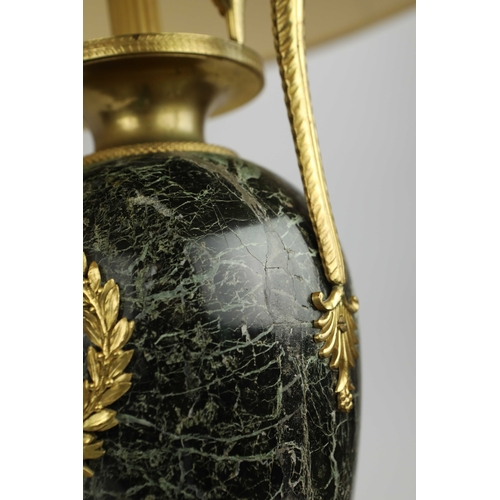 141 - A PAIR OF FRENCH GREEN VARIEGATED MARBLE EMPIRE LAMPS. (3). ormolu mounted with shades. Along with a... 