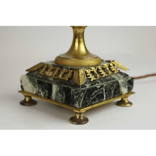 141 - A PAIR OF FRENCH GREEN VARIEGATED MARBLE EMPIRE LAMPS. (3). ormolu mounted with shades. Along with a... 