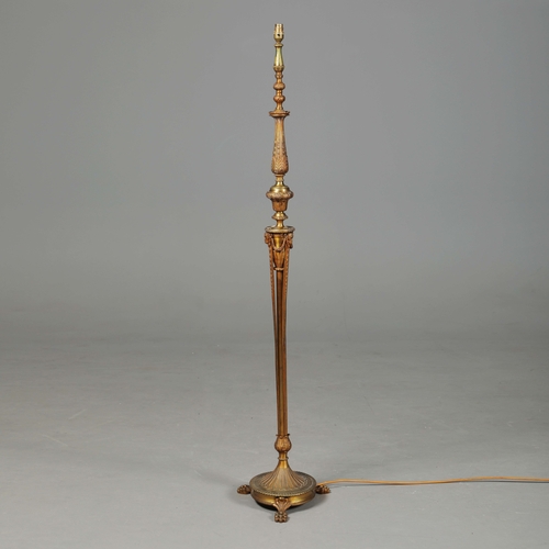 156 - BRASS STANDARD LAMP. with swag detail and three paw supports 155cm t.