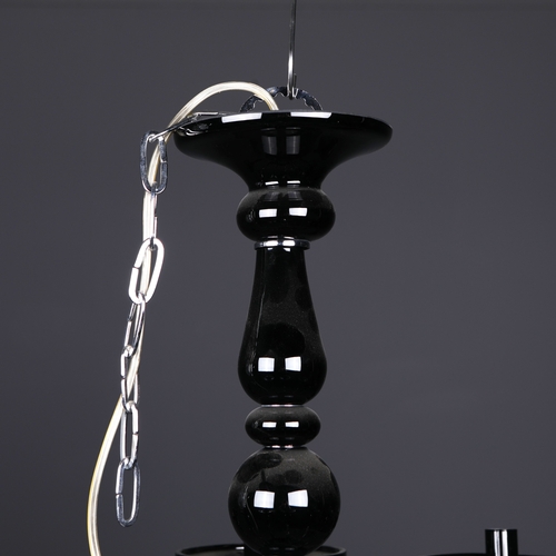 186 - BLACK GLASS CHANDELIER. 8 branch, 65cm drop approx. not including any chain or fittings.