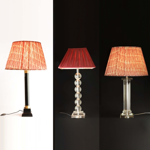 192 - SET OF THREE TABLE LAMPS WITH SHADES. One black column and two glass Each approx 60cm H.