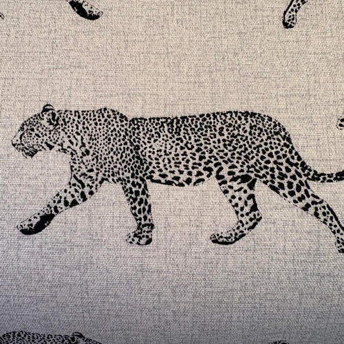 192 - LOW FOOTSTOOL IN LEOPARD PRINT UPHOLSTERY ON TURNED SUPPORTS. 38cm H x 100cm W x 50cm D.