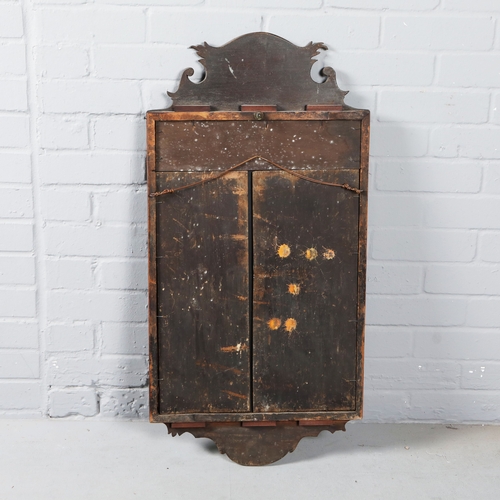 215 - WALL MIRROR. 19th C mahogany with a shaped frame 90cm t x 45 cm w.