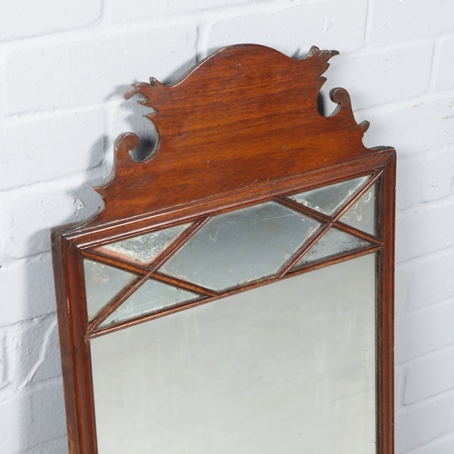 215 - WALL MIRROR. 19th C mahogany with a shaped frame 90cm t x 45 cm w.