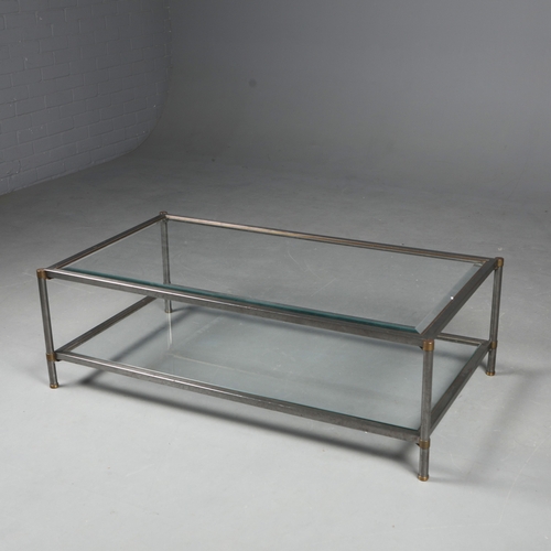 217 - COFFEE TABLE. the bevelled glass top on a metal base with brass trim over an under tier 41 cm t x 12... 