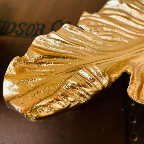 222 - PAIR OF GILT METAL TROPICAL LEAF SERVING DISHES. 7cm H x 50cm W x 20cm D.