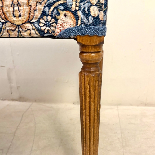224 - FOOTSTOOL IN WILLIAM MORRIS STYLE UPHOLSTERY ON REEDED SUPPORTS. 45cm H x 100cm W x 38cm D.