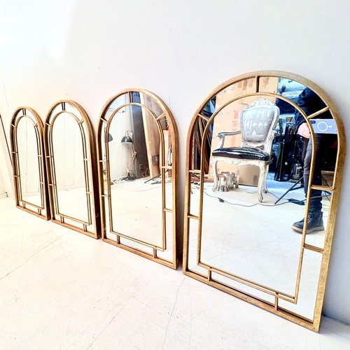 235 - SET OF FOUR ARCHED WALL MIRRORS WITH GILT METAL FRAMES. 82cm H x 49cm W.