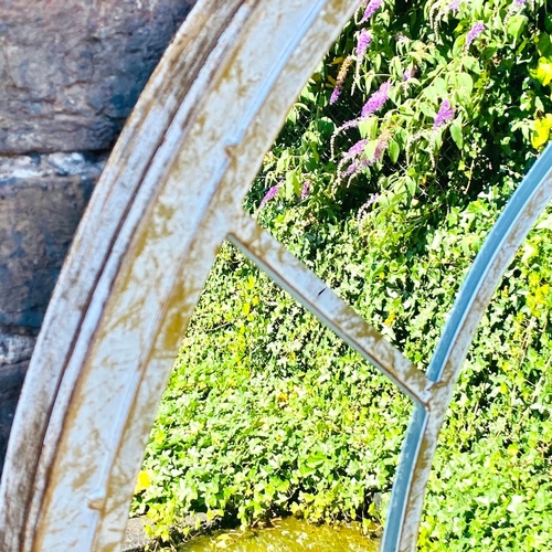 242 - SET OF THREE ARCHITECTURAL GARDEN MIRRORS WITH ARCHED METAL FRAMES. 160cm H x 67cm W.
