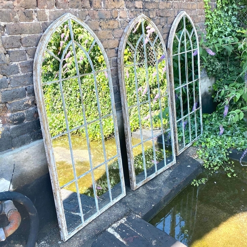 242 - SET OF THREE ARCHITECTURAL GARDEN MIRRORS WITH ARCHED METAL FRAMES. 160cm H x 67cm W.