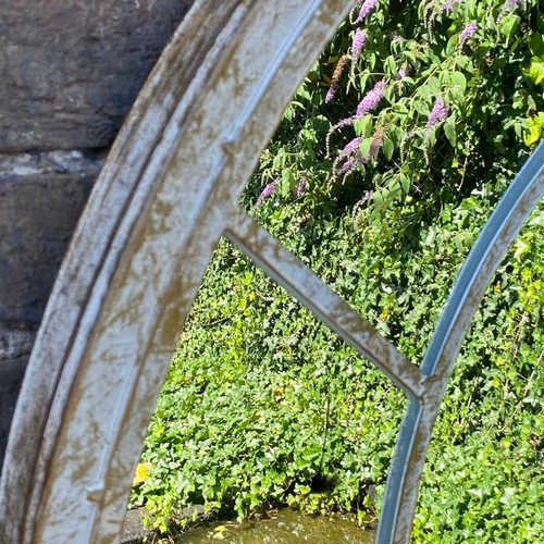 242 - SET OF THREE ARCHITECTURAL GARDEN MIRRORS WITH ARCHED METAL FRAMES. 160cm H x 67cm W.