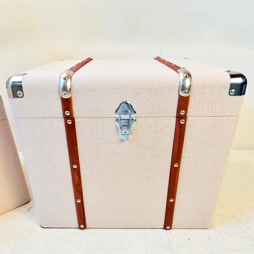 246 - GRADUATED SET OF THREE LUGGAGE STYLE TRUNKS IN LINEN. Largest 50cm H x 50cm W x 50cm D.
