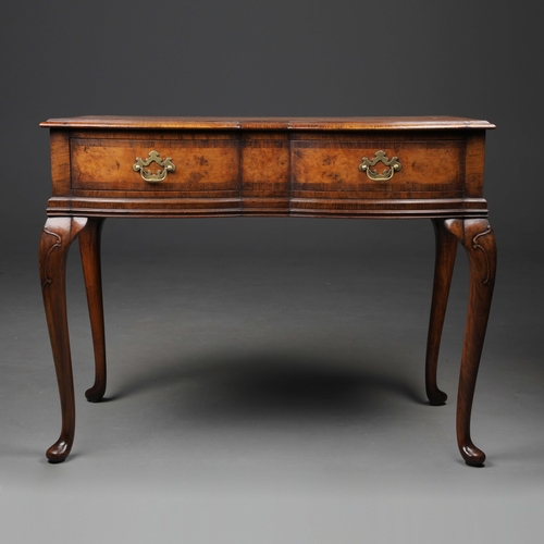 252 - QUEEN ANNE STYLE WALNUT SERPENTINE WRITING TABLE. Early 20th century with drawer and cabriole suppor... 