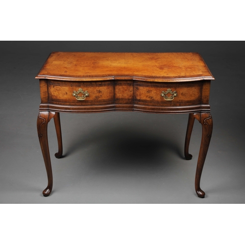 252 - QUEEN ANNE STYLE WALNUT SERPENTINE WRITING TABLE. Early 20th century with drawer and cabriole suppor... 