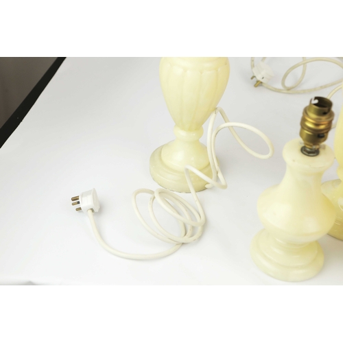 254 - TEN OYNX TABLE LAMPS. of various sizes, largest 39cm t, no shades, some with round plugs (10).