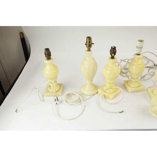 254 - TEN OYNX TABLE LAMPS. of various sizes, largest 39cm t, no shades, some with round plugs (10).