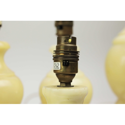 254 - TEN OYNX TABLE LAMPS. of various sizes, largest 39cm t, no shades, some with round plugs (10).