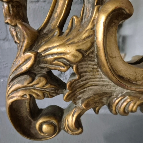 258 - A BAROQUE STYLE RECTANGULAR WALL MIRROR. elaborately moulded and gilded frame, with a large scrollin... 