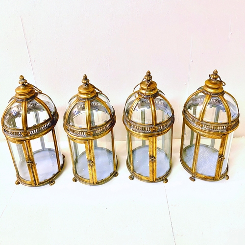 261 - SET OF FOUR REGENCY STYLE GILT METAL AND GLASS CANDLE LANTERNS. 46cm H x 20cm W x 20cm D.