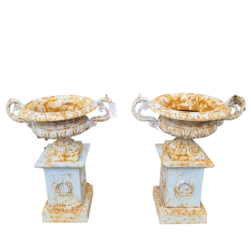 271 - CAMPANA STYLE GARDEN URNS ON STANDS, A PAIR. cast metal, each 98cm H at tallest approx. (2).