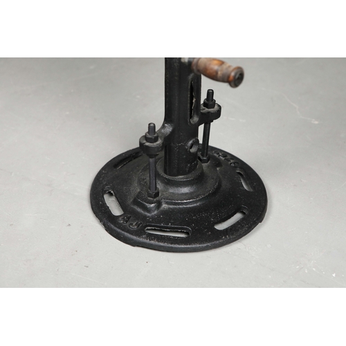 296 - CUSTOM SIDE TABLE WITH GLASS TOP ON INDUSTRIAL CAST IRON BASE. 64cm H x 60cm W.
