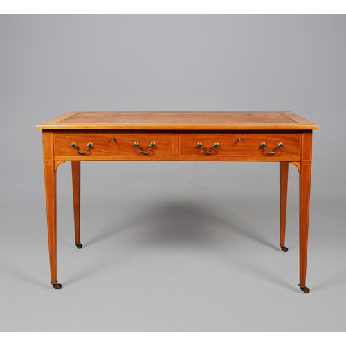 312 - EDWARDIAN MAHOGANY AND INLAID WRITING TABLE. tan leather top above two drawers on brass castors, 75c... 