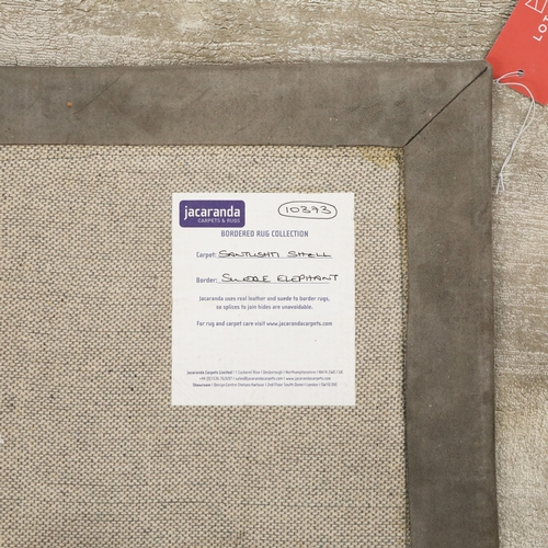 319 - JACARANDA SANTUSHTI SHELL CARPET WITH SUEDE ELEPHANT BORDER. 390cm x 392cm approx.