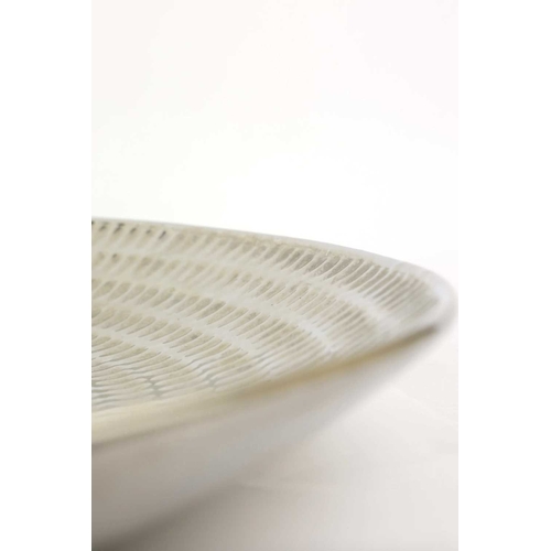 155 - A LARGE FINK CERAMIC PLATE IN A METALIC NICKEL GLAZE. with a repeat notch design, 60cm diam. approx.... 