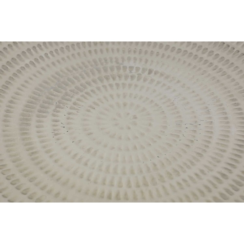 155 - A LARGE FINK CERAMIC PLATE IN A METALIC NICKEL GLAZE. with a repeat notch design, 60cm diam. approx.... 