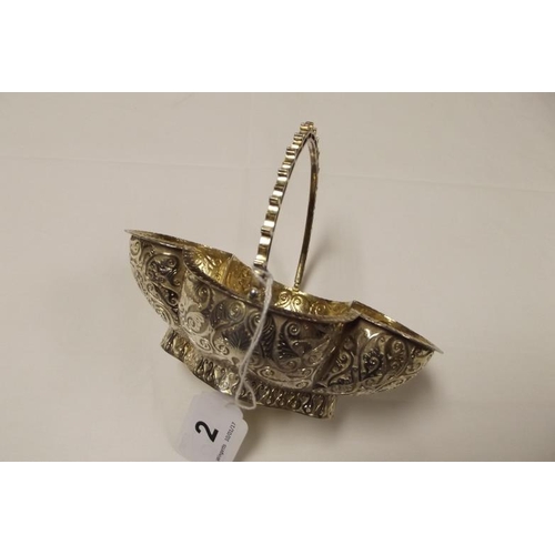 2 - Victorian silver gilt bon-bon dish with pierced swing handle, the shaped body with chased decoration... 