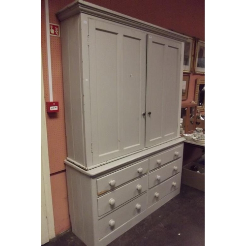 322 - Painted pine housekeeper's cupboard, ogive cornice over pair of panel doors enclosing a shelf lined ... 