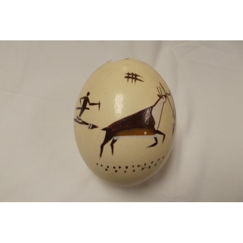 6 - Ostrich egg painted with native figures, 6 in. high.