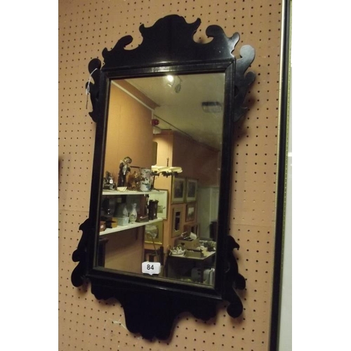 84 - 19th Century ebonised fret framed wall mirror, 27 in. x 15 in.