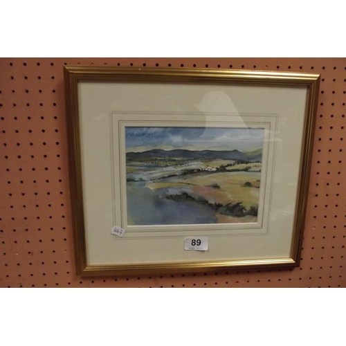 89 - Angela Jones, watercolour - extensive landscape with mountains beyond, monogrammed lower right.