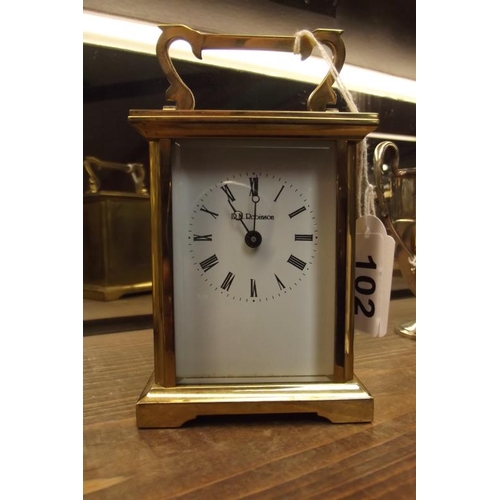 102 - Gilded brass cased carriage clock, D. M. Robinson, quartz movement.