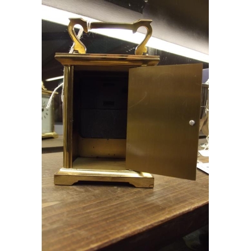 102 - Gilded brass cased carriage clock, D. M. Robinson, quartz movement.