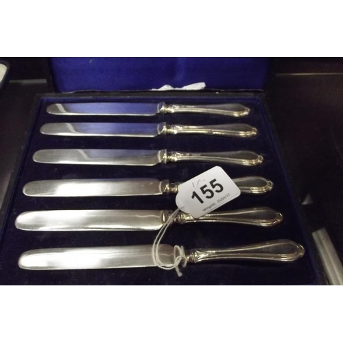 155 - Set of six silver handled dessert knives, in plush lined case.