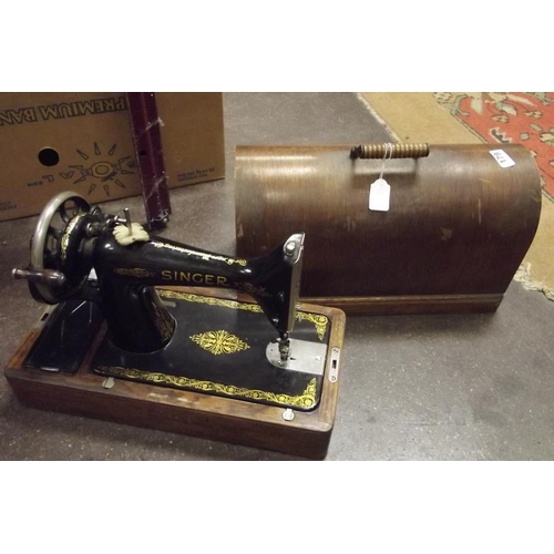 179 - Singer hand sewing machine, in oak case.