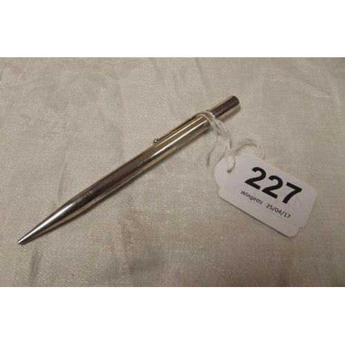 227 - Silver propelling pencil with engine turned decoration.