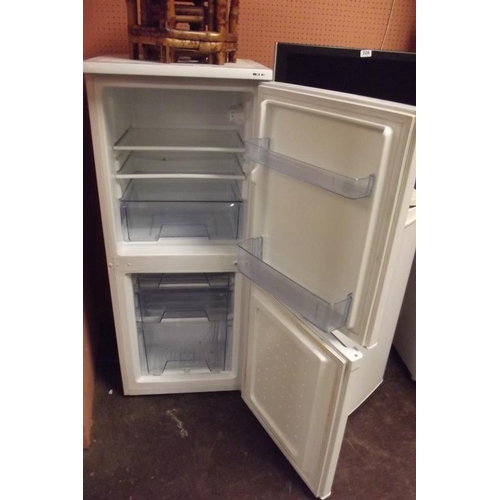 327 - An upright fridge/freezer.