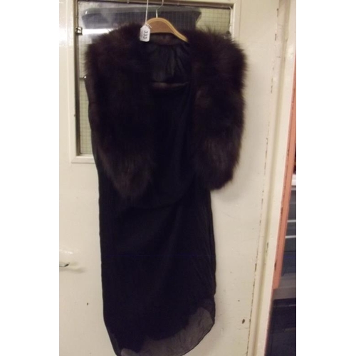 333 - Fox fur collar, and a black chiffon dress.