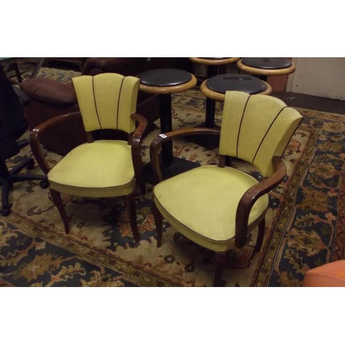 354 - Pair of Art Deco armchairs having upholstered backs and seats and on splayed frontal supports.