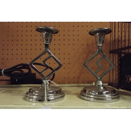 54 - Pair of Art Deco chrome SS candlesticks, 5.75 in. high.